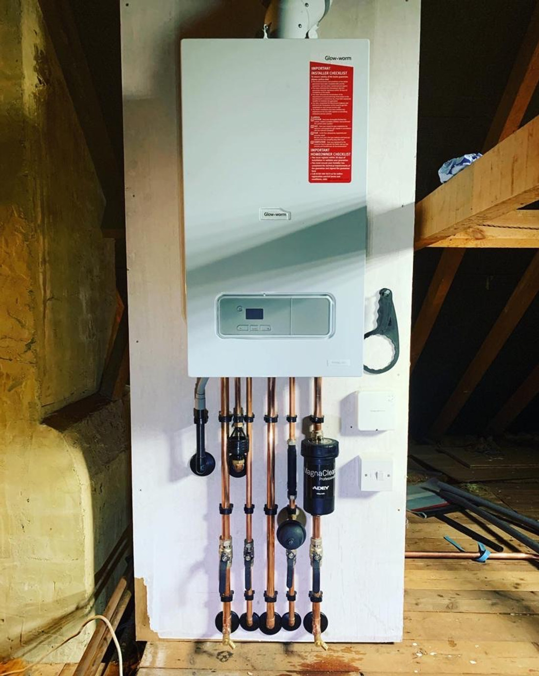 Neat boiler installation with tidy copper pipework by Smart Heat Experts